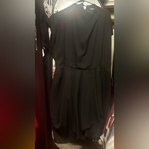 Cute little black dress! 100% polyester. Machine wash.